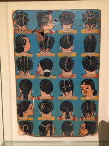 Image of Hand painted sign illustrating twenty-four hair styles for women