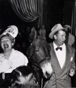 Image of Untitled (Hedda Hopper, Mule and Man at Party)